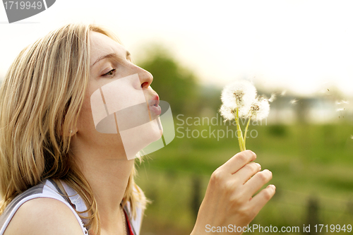 Image of Woman With Dandelion