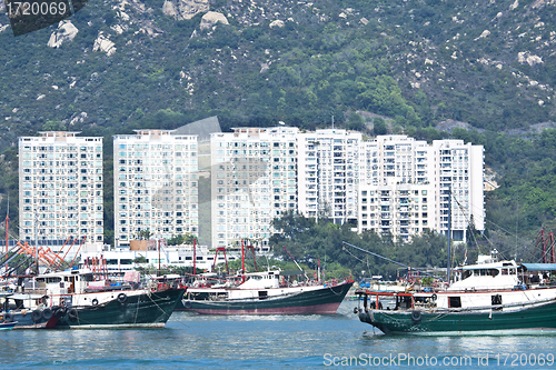 Image of Fishing boats and apartment blocks in Hong Kong