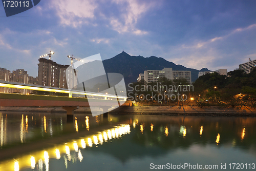 Image of Sunset along the river in city