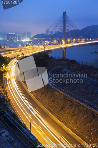 Image of Ting Kau Bridge and highway at night in Hong Kong