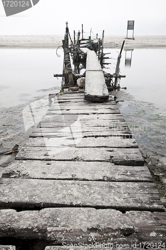 Image of Desolated wooden pier in low saturation