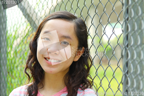 Image of Asian woman outdoor with smile