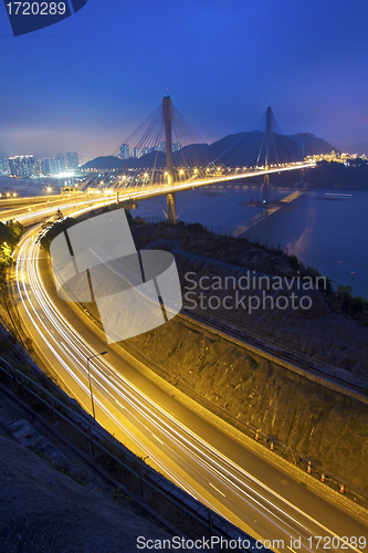 Image of Ting Kau Bridge at night along the highway in Hong Kong