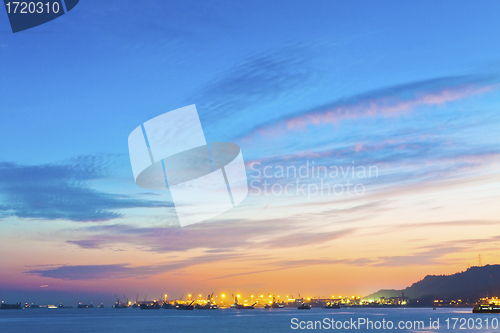 Image of Sunset ocean with catgo ships 