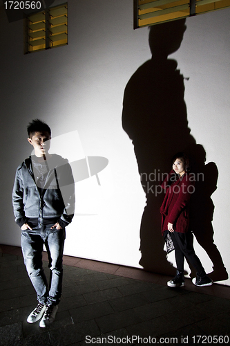 Image of Asian woman and man on street