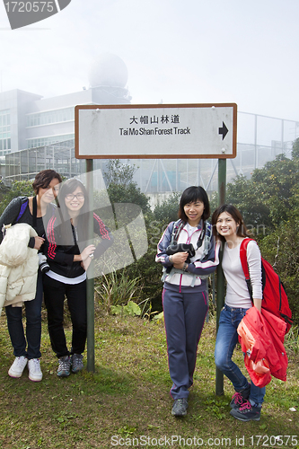 Image of Chinese woman friends hiking