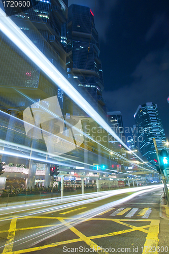 Image of Modern city with busy traffic at night