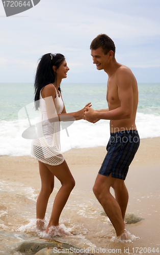 Image of A man and woman enjoy life at the beach