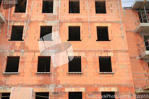 Image of residential building under construction in red brick