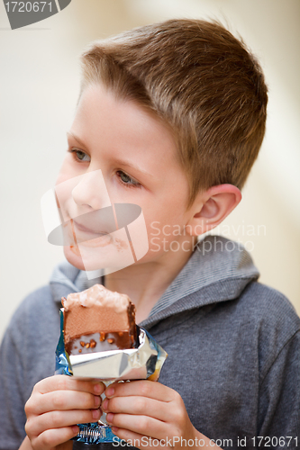 Image of Little boy eating ice cream