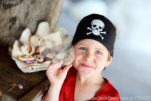 Image of Portrait of playful pirate boy
