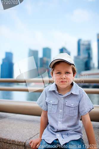 Image of Cute boy in big modern city