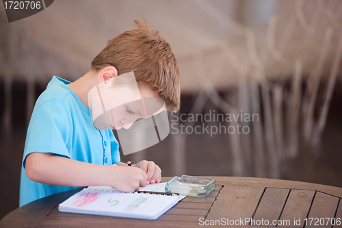 Image of Boy drawing or writing