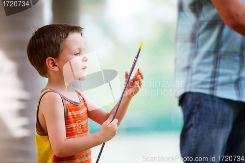 Image of Boy with archery arrow