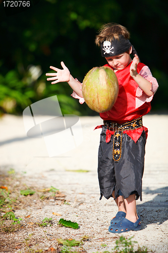 Image of Boy dressed as pirate with coconut