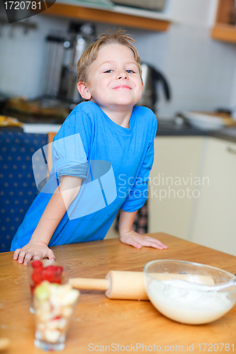 Image of Boy helping at kitchen