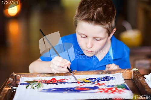 Image of Boy painting a batik