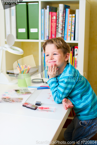 Image of Cute little boy studying