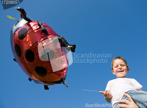 Image of Little boy and balloon