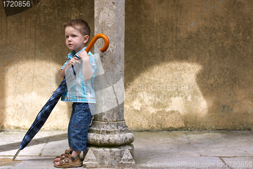 Image of Little one with big umbrella