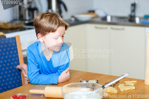 Image of Boy helping at kitchen