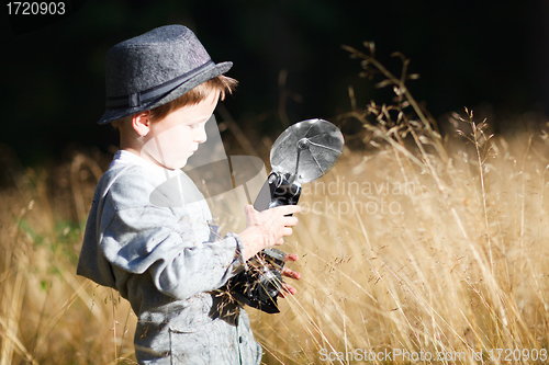 Image of Boy with retro camera