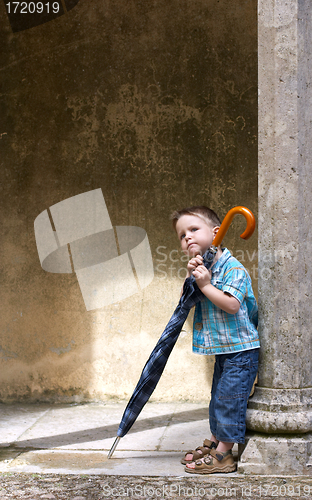 Image of Little one with big umbrella