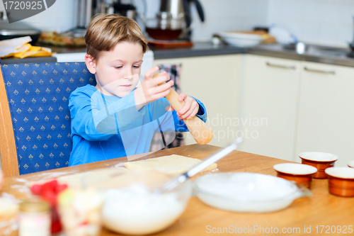 Image of Boy helping at kitchen