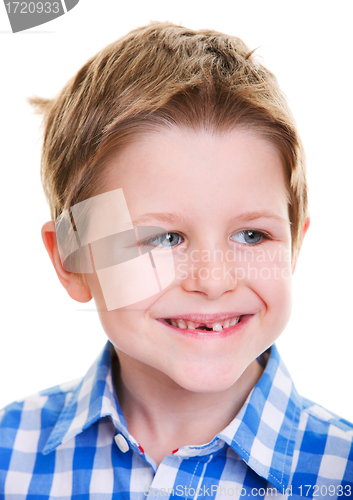 Image of Cute boy showing missing tooth