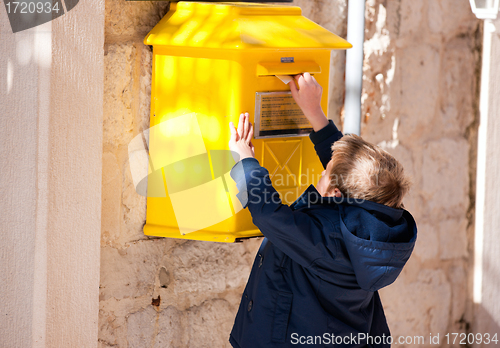 Image of Boy sending letter