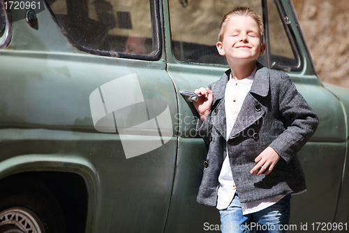 Image of Boy near car