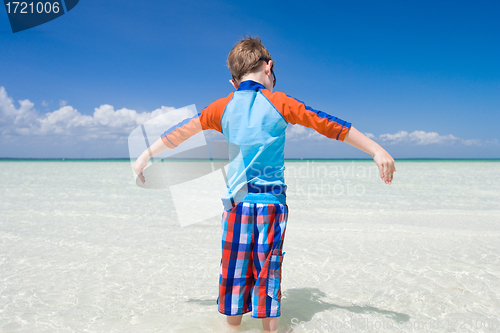 Image of Little boy in shallow water