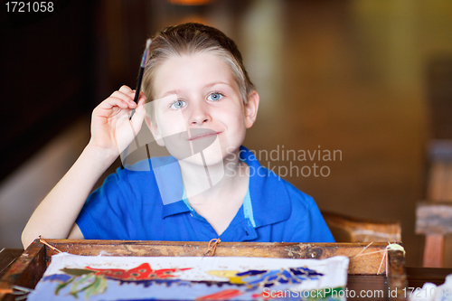 Image of Boy painting a batik