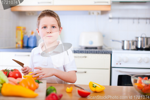 Image of Little boy helping at kitchen