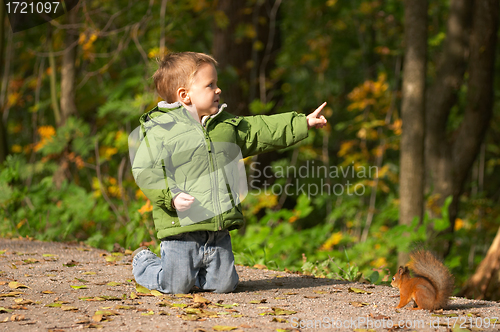 Image of Little boy and squirrel