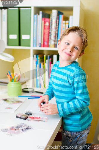 Image of Cute little boy studying