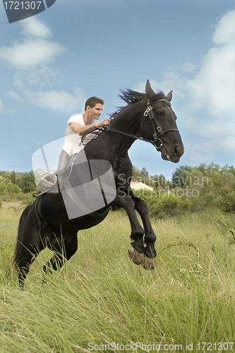 Image of young man and horse