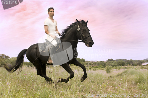 Image of young man and horse