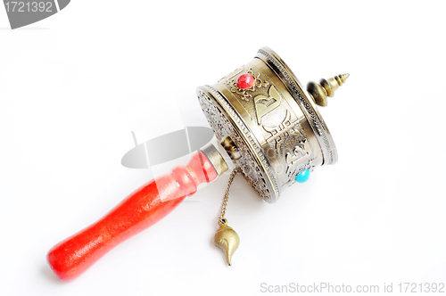 Image of Tibetan prayer wheel on a white background