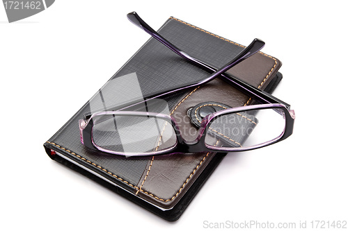 Image of notebook and glasses 