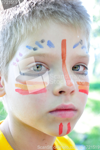 Image of boy with football paintings on face