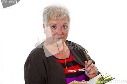 Image of Female senior reading a book