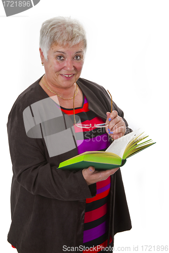 Image of Female senior reading a book