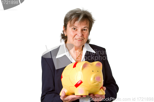 Image of Female senior with piggy bank 