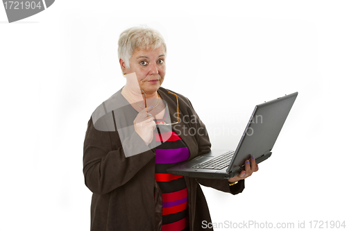 Image of Skeptic female senior with laptop