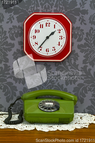 Image of Retro telephone and Kitchen clock