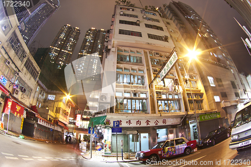 Image of Hong Kong downtown at night - old apartments and modern building
