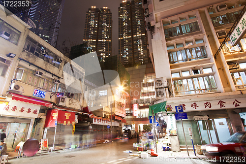Image of Hong Kong downtown at night - old apartments and modern building