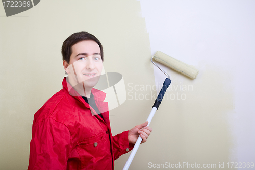 Image of Man painting a wall