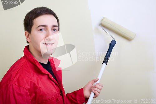 Image of Man painting a wall